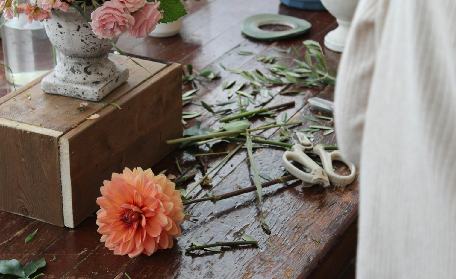 Detailed view of custom floral design work showcasing individual attention to arrangement details