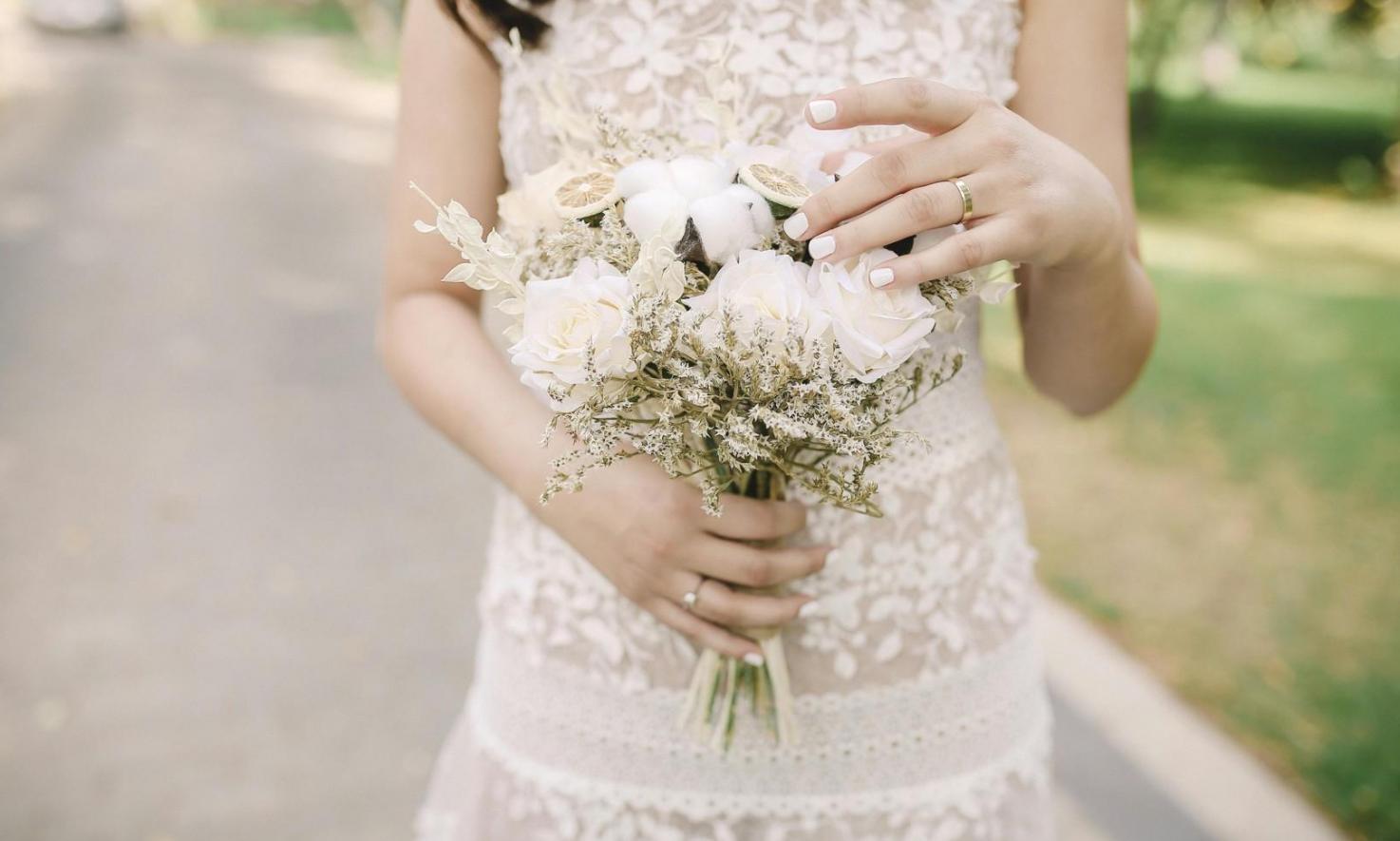 Professional floral arrangement process showing detailed flower selection and design
